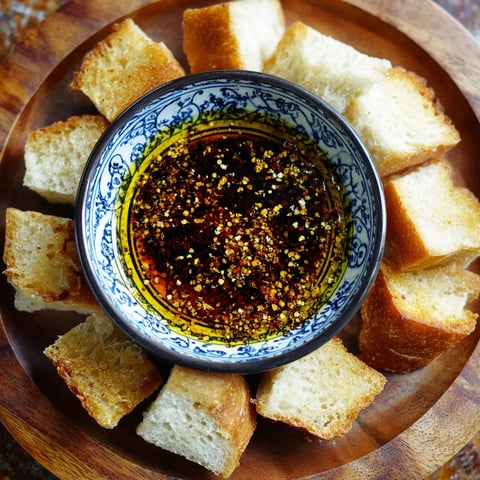 A bowl of bread dipping oil.
